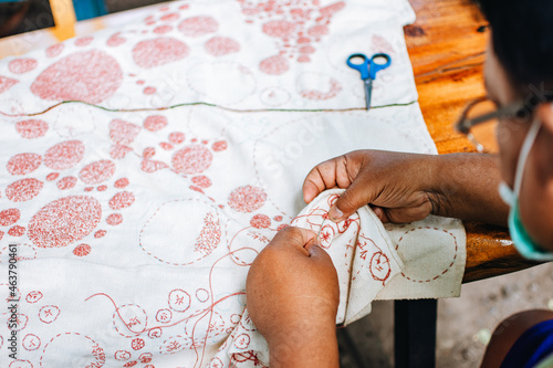 Man's hands sewing beautiful fabric. Traditional embroidery, learning ,teaching ,how to do,hand craft,hobby, embroidery stitch concept.