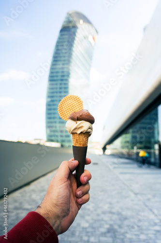 Man holding ice-cream in Milano, Italy