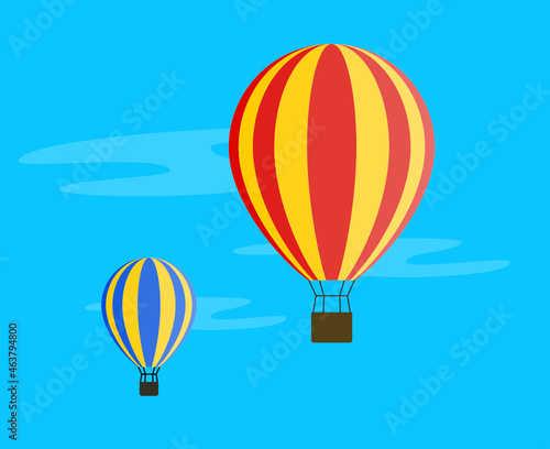 Two hot air balloons flying in blue sky