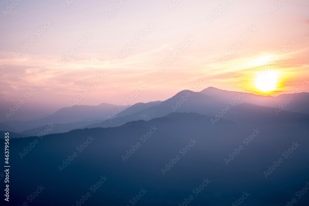Stunning sunset in the mountains, pink, blue, orange, calm scene, peaceful location