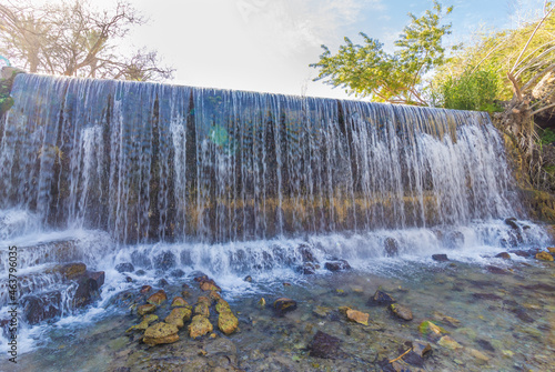 Fototapeta Naklejka Na Ścianę i Meble -  An amazing waterfall in the famous Sahna - gan hashlosha Nature Reserve, near Kibbutz Nir David, Israel
