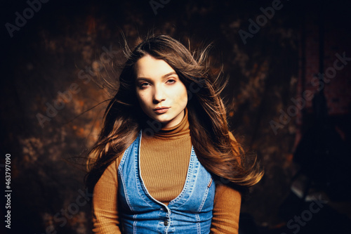 Emotion on the face of a beautiful girl on a canvas backdrops background