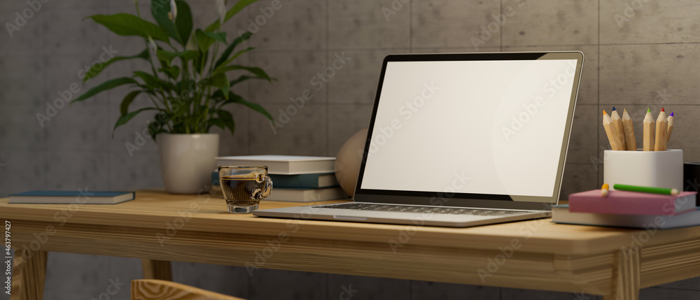 Modern simple home workspace with laptop blank screen mockup and decor on wooden desk. Modern simple home workspace with laptop blank screen mockup and decor on wooden desk.
