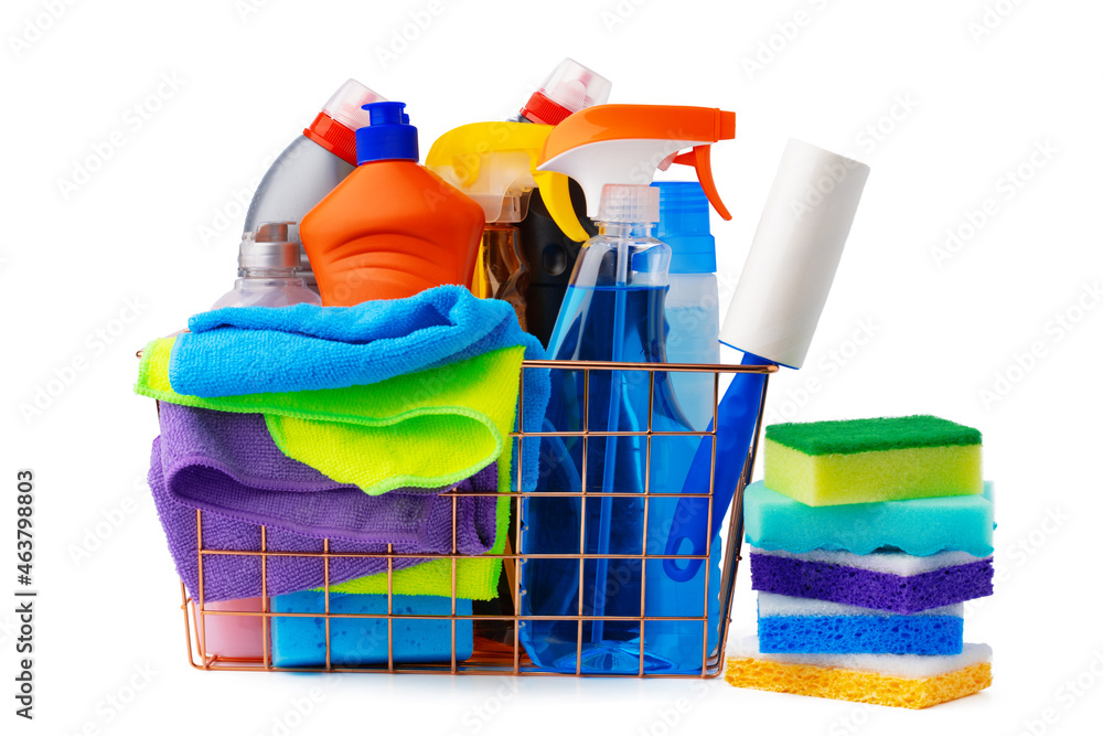 Basket with cleaning products on blue background. Cleaning with