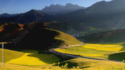 Rapeseed Sea Scenery in Menyuan County, Qinghai. Beautiful landscape of mountains in Qinghai, China. (time-lapse) photo