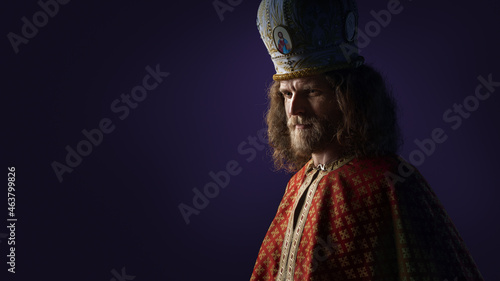 Saint Nicholas - Sinterklaas - Dutch Santa - young man face with beard in red mitre with cross portrait. High quality photo