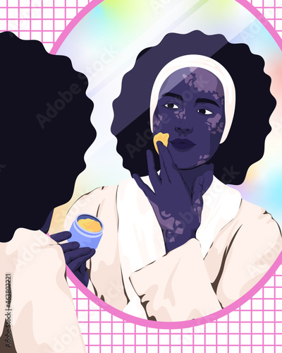 Woman looking in mirror applying skin care cream