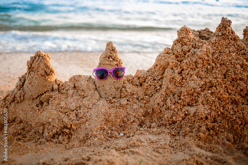Sand castle on a sandy sea beach