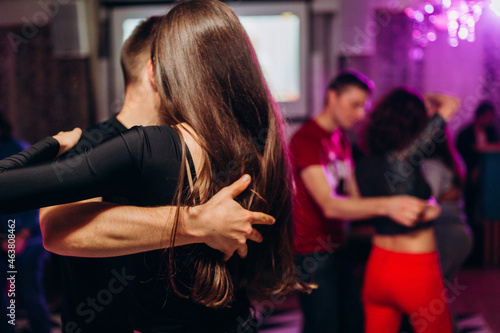 Fototapeta Naklejka Na Ścianę i Meble -  Kharkiv, Ukraine 17.08.21 People dancing bachata on the dance floor