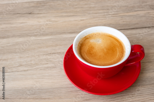 Hot espresso coffee on table  Red coffee cup in cafe or home.Top view with blank copy space for your text.