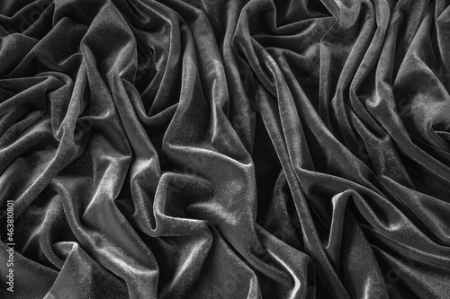 Luxurious black silk satin cloth flat lay background