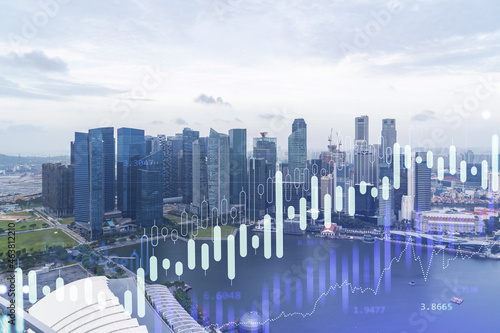 Photography Financial stock chart hologram over panorama city view of Singapore, business center in Asia