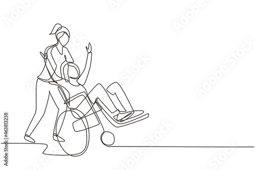 Continuous one line drawing young female volunteer helps disabled old woman, riding on wheelchair in park. Family care, volunteerism, disability care concept. Single line draw design vector graphic photo