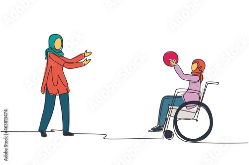 Single one line drawing happy lifestyle of disabled people concept. Little Arab girl in wheelchair playing ball with female friend outdoors living active lifestyle. Continuous line draw design vector