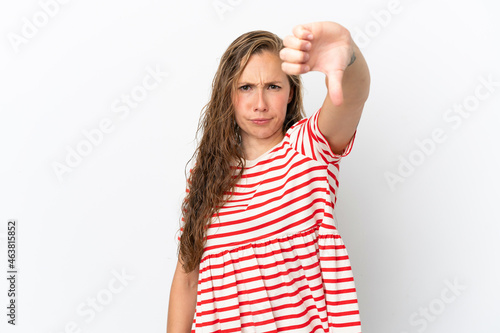 Young caucasian woman isolated on white background showing thumb down with negative expression