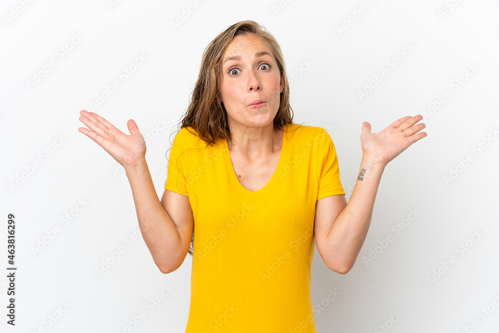 Fototapeta premium Young caucasian woman isolated on white background making doubts gesture