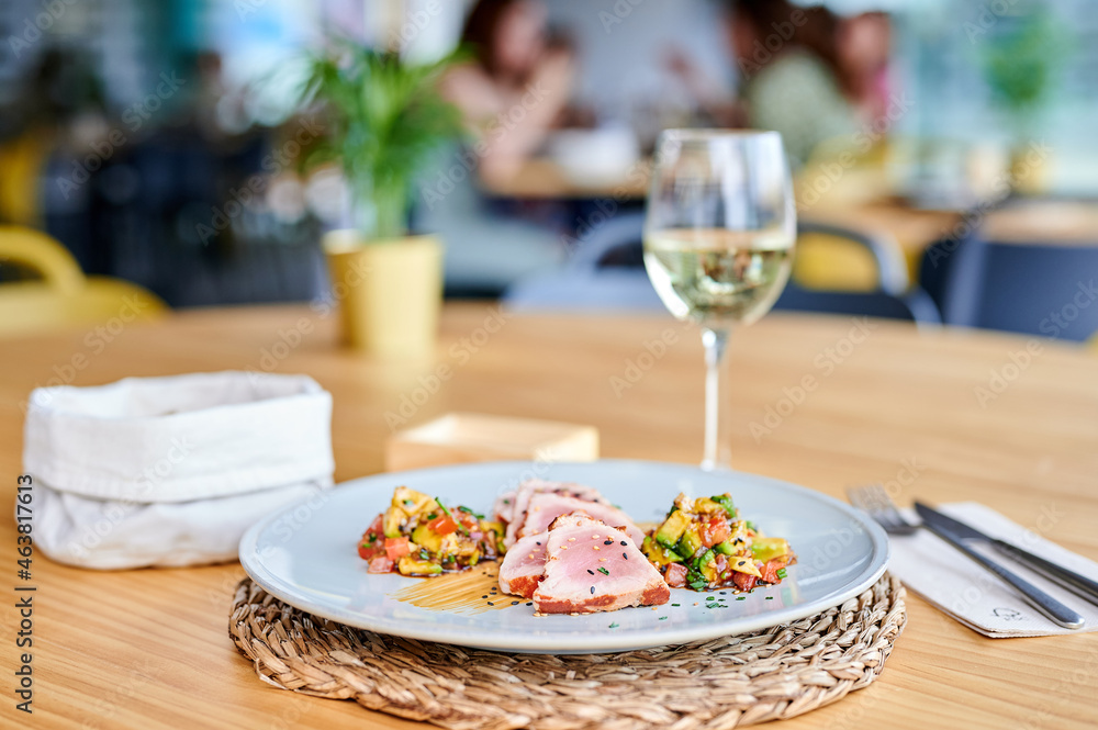 Pork fillet with salad near wine