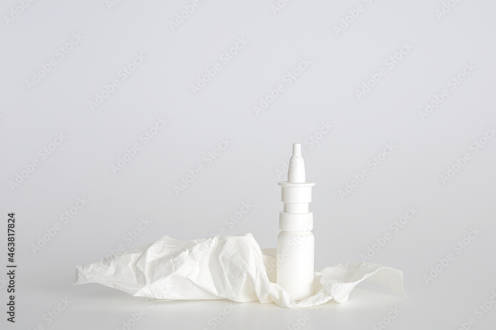 White plastic nasal spray bottle on white background. Nasal spray