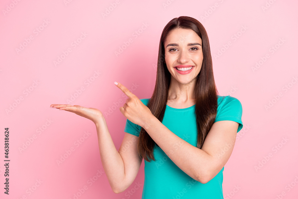 Photo of young woman happy positive point finger promo advert decision isolated over pink color background Photo of young woman happy positive point finger promo advert decision isolated over pink color background