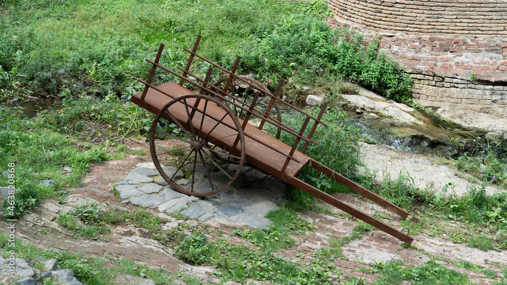 old rusty cart. rotten old cart in the park. poverty concept