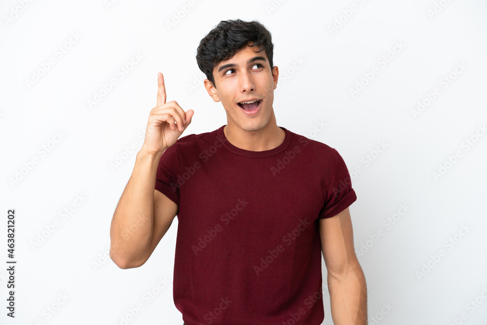 Young Argentinian man isolated on white background intending to realizes the solution while lifting a finger up Young Argentinian man isolated on white background intending to realizes the solution while lifting a finger up