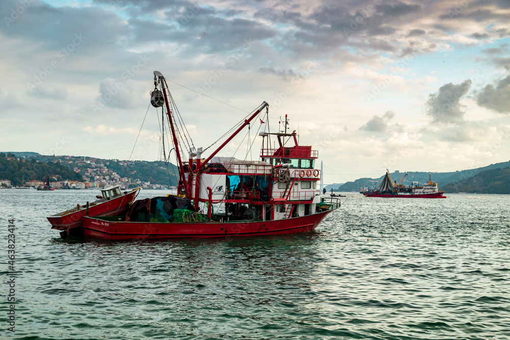 fisherman fishing boats on Bosporus Istanbul on a Foggy sunrise. Rainy clouds and dark weather fisherman fishing boats on Bosporus Istanbul on a Foggy sunrise. Rainy clouds and dark weather
