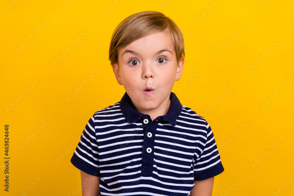 Photo portrait little boy wearing casual clothes staring amazed isolated bright yellow color background