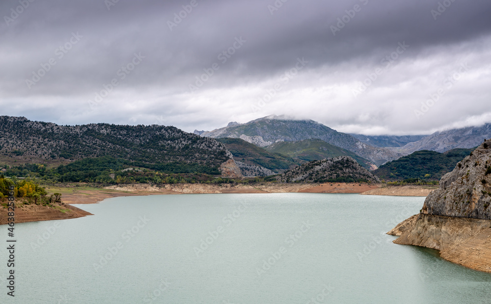 Barrios de Luna reservoir, mountains and cloudy sky. Province of León, Spain.