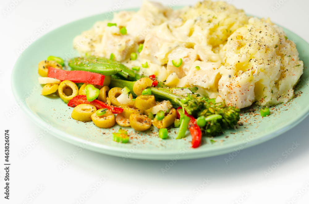 Tender pieces of smoked haddock and pollock in a creamy cheese sauce sat beneath buttery mash served with vegetables Tender pieces of smoked haddock and pollock in a creamy cheese sauce sat beneath buttery mash served with vegetables