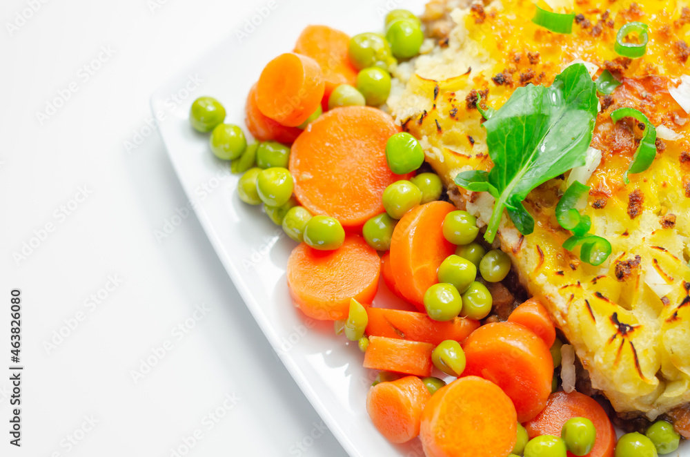 Shepherd's pie, tender minced lamb with garden veg in a hearty gravy beneath butter mash with carrots and green peas Shepherd's pie, tender minced lamb with garden veg in a hearty gravy beneath butter mash with carrots and green peas
