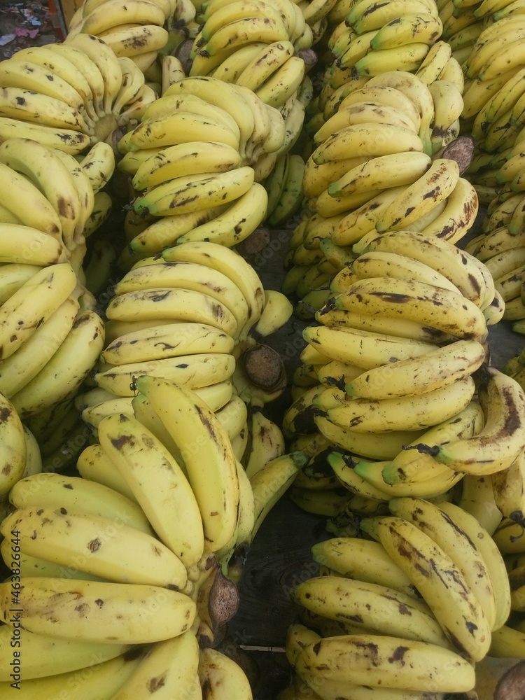 bunch of bananas on market stall