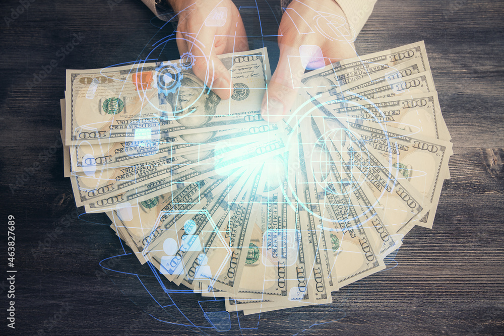 Multi exposure of social network theme drawing hologram and USA dollars bills and man hands. Multi exposure of social network theme drawing hologram and USA dollars bills and man hands.