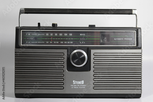 1970s-1980s portable AMFM portable stereo with 8 track cassette player. Flat white background
 photo