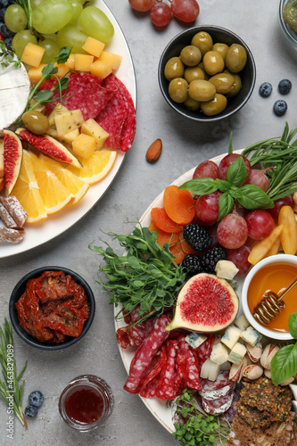 Set of different delicious appetizers served on light grey table  flat lay