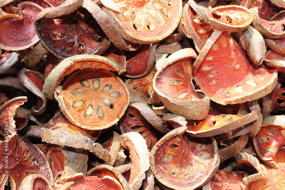 Dried bael fruit background. Close up dried herb. Many of slices of bael fruit . Dried bael fruit background. Close up dried herb. Many of slices of bael fruit .