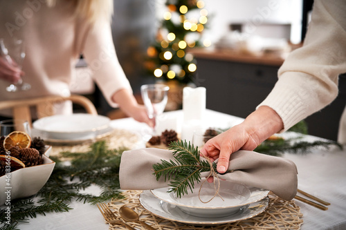 Bilde på lerret Close up of women preparing table for Christmas Eve