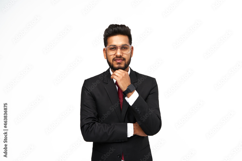 Portrait of young indian businessman with crossed arms on white isolated background
