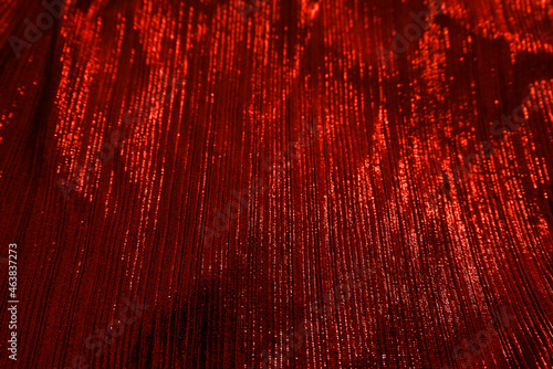 Red reflect velvet fabric texture used as background. Empty red fabric background of soft and smooth textile material. There is space for text..