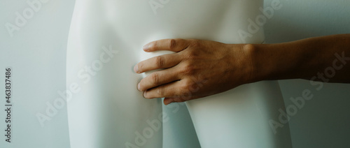 man covers the mannequins crotch, we banner