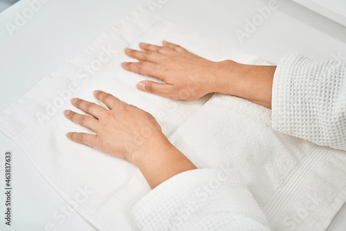 Close up of hands lying on the towel