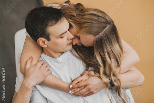Close up portrait of young attractive romantic couple hugging, being loving with each other. Love and relationships lifestyle