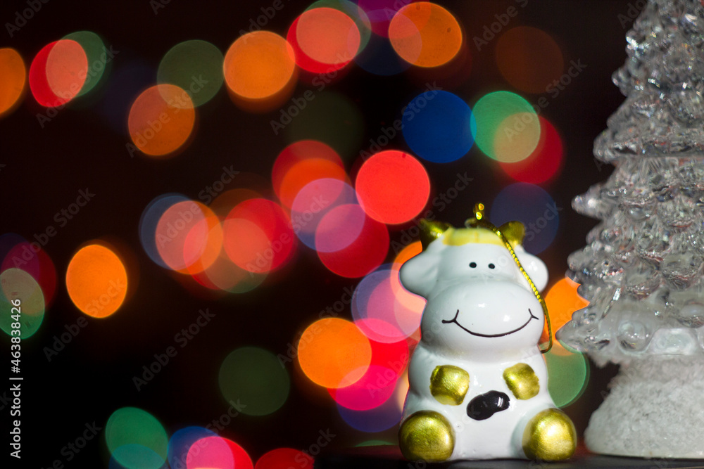 Christmas unfocused Christmas tree, blurry colored bokeh background. New Year 2022