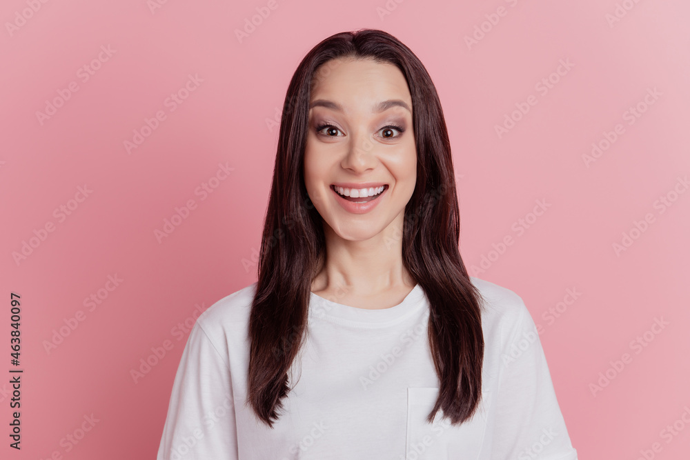 Photo of young excited girl amazed shock surprised good news sale isolated over pink color background Photo of young excited girl amazed shock surprised good news sale isolated over pink color background