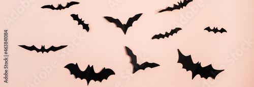 Happy Halloween. Bats on pink pastel background.