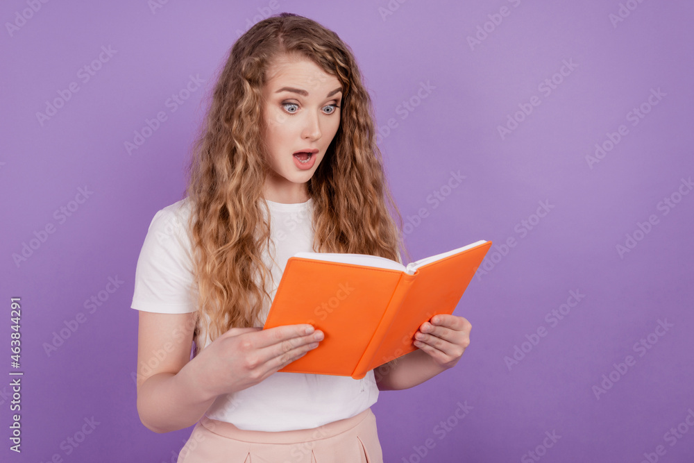 Photo of excited speechless lady read book open mouth wear casual outfit on purple background Photo of excited speechless lady read book open mouth wear casual outfit on purple background