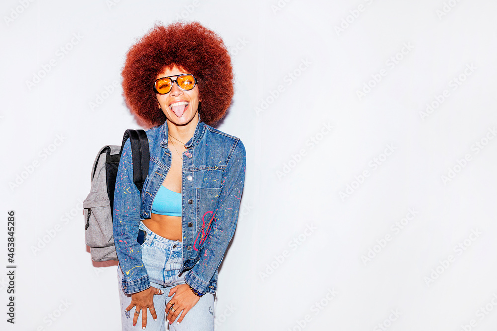 Cheerful woman with Afro hairstyle and a backpack Cheerful woman with Afro hairstyle and a backpack