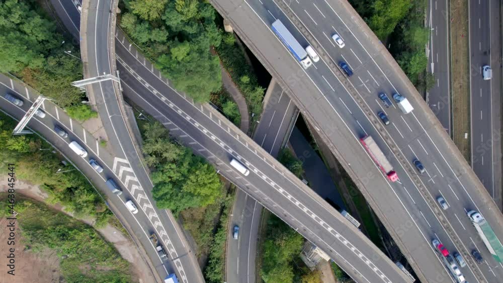 Vehicles Driving on a Spaghetti Interchange Bird's Eye Aerial View Vehicles Driving on a Spaghetti Interchange Bird's Eye Aerial View