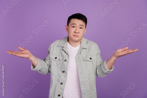 Clueless indifferent korean man shrug shoudlers dont know answer doubt uncertain unsure mood
