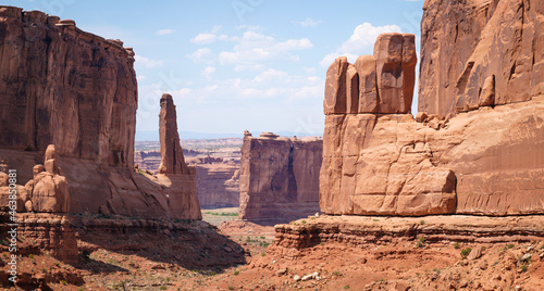 Panorama of red sandstone towers and cliff features in Arches National Park, Utah. Landmark known as Park Avenue.