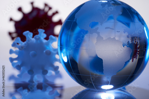 3d printed icon of coronavirus and glass globe on white background with reflection